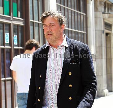 Stephen Fry
seen out walking in central London looking scruffy and unshaven. 
London, England.