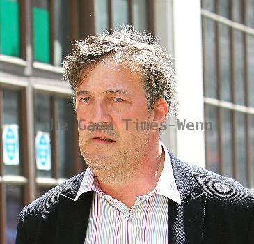 Stephen Fry
seen out walking in central London looking scruffy and unshaven. 
London, England.