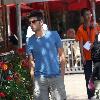 Adam Scott shops at the Apple store in The Grove Los Angeles.