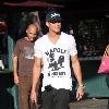 Adam Senn walks his dog whilst shopping at The Grove with a friend Los Angeles.