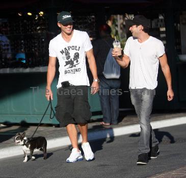 Adam Senn walks his dog whilst shopping at The Grove with a friend Los Angeles.