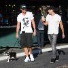 Adam Senn walks his dog whilst shopping at The Grove with a friend Los Angeles.