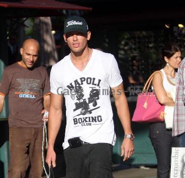 Adam Senn walks his dog whilst shopping at The Grove with a friend Los Angeles.