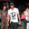 Adam Senn walks his dog whilst shopping at The Grove with a friend Los Angeles.