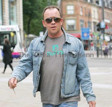 Todd Carty out and about in Leeds Town centre holding a grocery bag.
London, England.