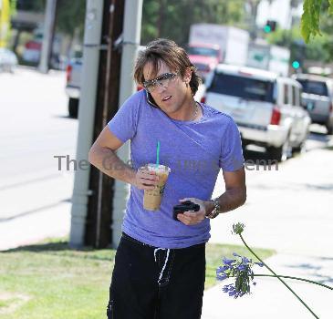 Larry Birkhead 
departs Starbuck after getting and iced coffee
Los Angeles, California.