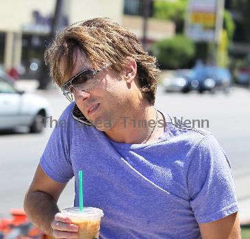 Larry Birkhead 
departs Starbuck after getting and iced coffee
Los Angeles, California.