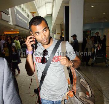 Ashley Cole 
arriving at Heathrow airport
London, England.