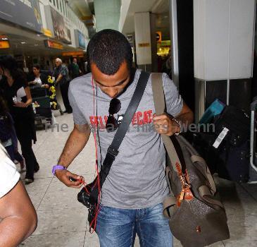 Ashley Cole 
arriving at Heathrow airport
London, England.