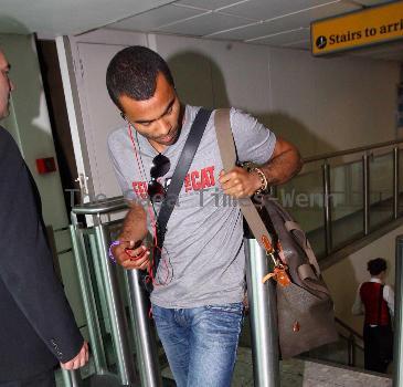 Ashley Cole 
arriving at Heathrow airport
London, England.