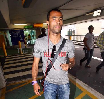 Ashley Cole 
arriving at Heathrow airport
London, England.