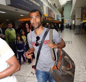 Ashley Cole 
arriving at Heathrow airport
London, England.