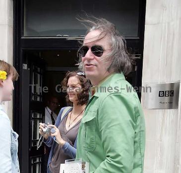 REM guitarist Peter Buck 
leaving the BBC Radio Two studios where he was promoting his new side project, Tired Pony
London, England.