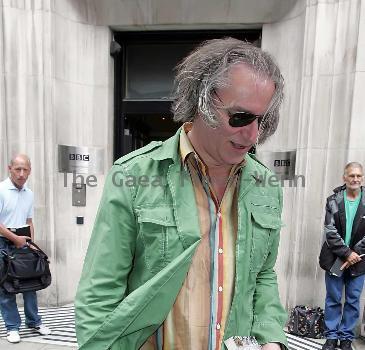 REM guitarist Peter Buck 
leaving the BBC Radio Two studios where he was promoting his new side project, Tired Pony
London, England.