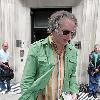 REM guitarist Peter Buck 
leaving the BBC Radio Two studios where he was promoting his new side project, Tired Pony
London, England.