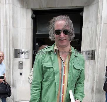 REM guitarist Peter Buck 
leaving the BBC Radio Two studios where he was promoting his new side project, Tired Pony
London, England.