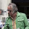 REM guitarist Peter Buck 
leaving the BBC Radio Two studios where he was promoting his new side project, Tired Pony
London, England.