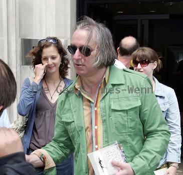 REM guitarist Peter Buck 
leaving the BBC Radio Two studios where he was promoting his new side project, Tired Pony
London, England.