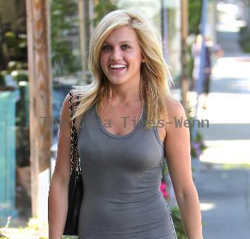 Pussycat Doll Ashley Roberts in a tight grey dress leaves the Ken Paves hair salon after attending the charity event,