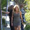 Pussycat Doll Ashley Roberts in a tight grey dress leaves the Ken Paves hair salon after attending the charity event,