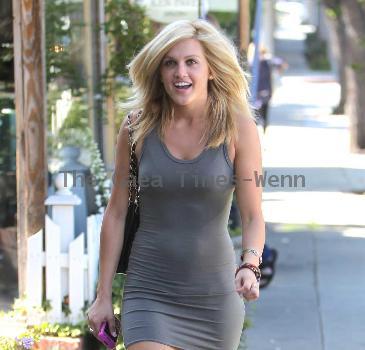 Pussycat Doll Ashley Roberts in a tight grey dress leaves the Ken Paves hair salon after attending the charity event,