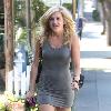 Pussycat Doll Ashley Roberts in a tight grey dress leaves the Ken Paves hair salon after attending the charity event,