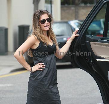 Carley Zucker loading her car with luggage and a cot, as she prepares to move to Liverpool, where footballer husband, Joe Cole, has just signed up for the Football Club.  London.