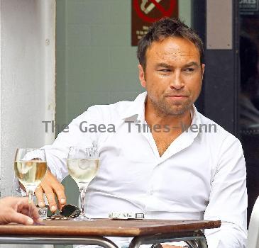 Radio Talk SPORT host and Ex-Chelsea footballer Jason Cundy. He also the husband of Television presenter Lizzie Cundy, enjoys a glass of wine near Waterloo Train Station London.