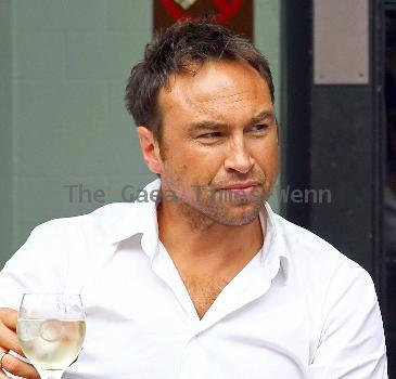 Radio Talk SPORT host and Ex-Chelsea footballer Jason Cundy. He also the husband of Television presenter Lizzie Cundy, enjoys a glass of wine near Waterloo Train Station London.