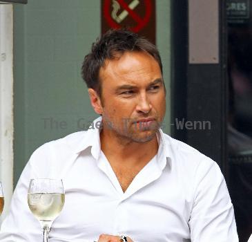 Radio Talk SPORT host and Ex-Chelsea footballer Jason Cundy. He also the husband of Television presenter Lizzie Cundy, enjoys a glass of wine near Waterloo Train Station London.