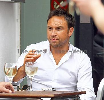 Radio Talk SPORT host and Ex-Chelsea footballer Jason Cundy. He also the husband of Television presenter Lizzie Cundy, enjoys a glass of wine near Waterloo Train Station London.