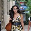 Myleene Klass was spotted outside the GMTV studios in London. The television personality looked very glamorous in a fashionable tiger print dress London.