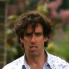 Comedy actor Stephen Mangan walking with a shopping bag in North London London.