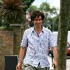 Comedy actor Stephen Mangan walking with a shopping bag in North London London.