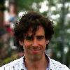 Comedy actor Stephen Mangan walking with a shopping bag in North London London.