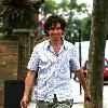 Comedy actor Stephen Mangan walking with a shopping bag in North London London.