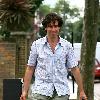 Comedy actor Stephen Mangan walking with a shopping bag in North London London.