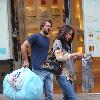 Paul Nicholls and his wife Chantal Brown
picking up dry cleaning in North London
London, England.