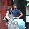 Paul Nicholls and his wife Chantal Brown
picking up dry cleaning in North London
London, England.