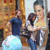 Paul Nicholls and his wife Chantal Brown
picking up dry cleaning in North London
London, England.