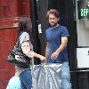 Paul Nicholls and his wife Chantal Brown
picking up dry cleaning in North London
London, England.