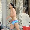 Russell Brand
wears little more than blue underwear while filming a scene on the set of his new movie 'Arthur'
New York City, USA.