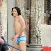 Russell Brand
wears little more than blue underwear while filming a scene on the set of his new movie 'Arthur'
New York City, USA.