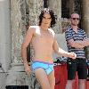 Russell Brand
wears little more than blue underwear while filming a scene on the set of his new movie 'Arthur'
New York City, USA.