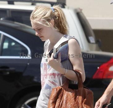 Dakota Fanning
is seen leaving the gym in Studio City with her dad.
Los Angeles, California.