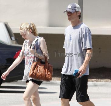 Dakota Fanning
is seen leaving the gym in Studio City with her dad.
Los Angeles, California.