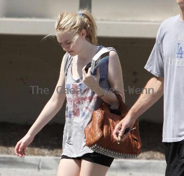 Dakota Fanning
is seen leaving the gym in Studio City with her dad.
Los Angeles, California.