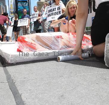 PETA Members show Manhattan that 'we're all made of flesh' at their latest demonstration 'Naked and Wrapped in Cellophane' held at the Times Square intersection, 45th and Broadway New York City.