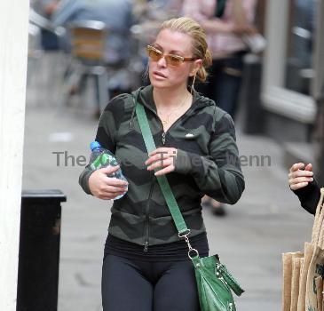 Anastacia looking red in the face as she leaves a Bikram Yoga studio in Richmond after a work out.  The American singer-songwriter, who is currently hosting Channel Five's 'Don't Stop Believing', was then seen heading to a supermarket where she did a food shop.
London, England.