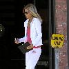 AnnaLynne McCord wearing a white Juicy Couture velour tracksuit leaving a hair salon in West Hollywood Los Angeles.